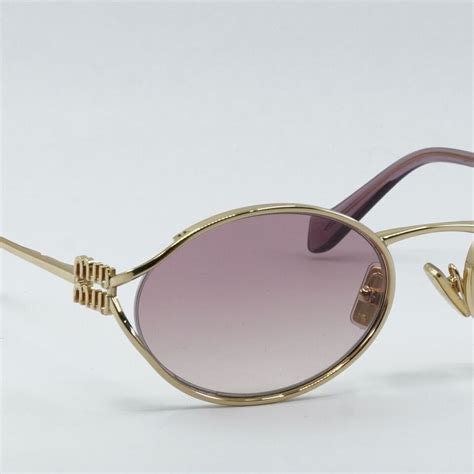 Miu Miu MU52YS 5AK06S Sunglasses in Gold.